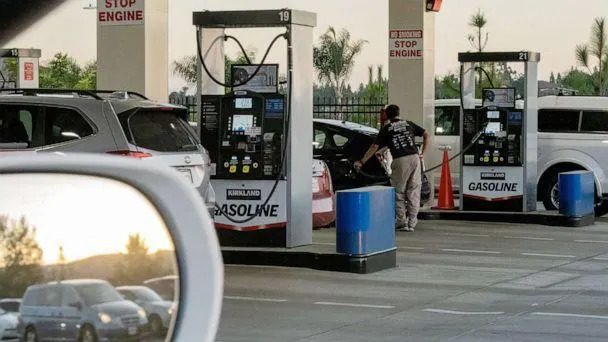 PHOTO: Drivers refuel vehicles at a gas station in San Diego, Oct. 20, 2021. (Bloomberg via Getty Images, FILE)