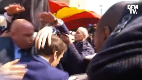 Chaos as French Secret Service rush to protect President Emmanuel Macron with ?8000 umbrella after he